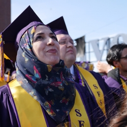Woman wearing a hijab and SFSU regalia